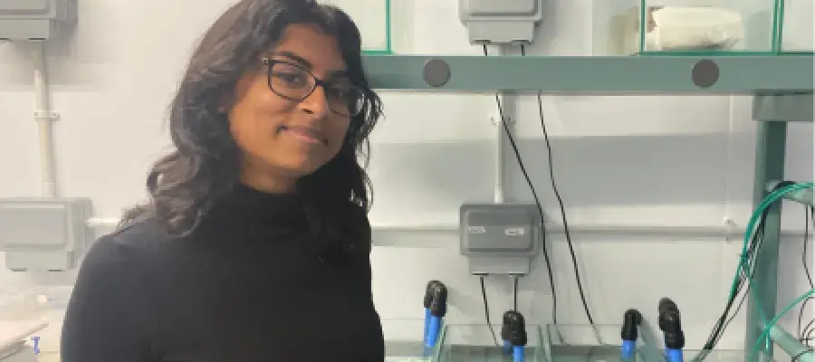 Anushka in her lab with her coral tanks