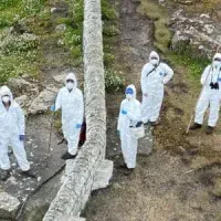 Scientists in personal protective gear